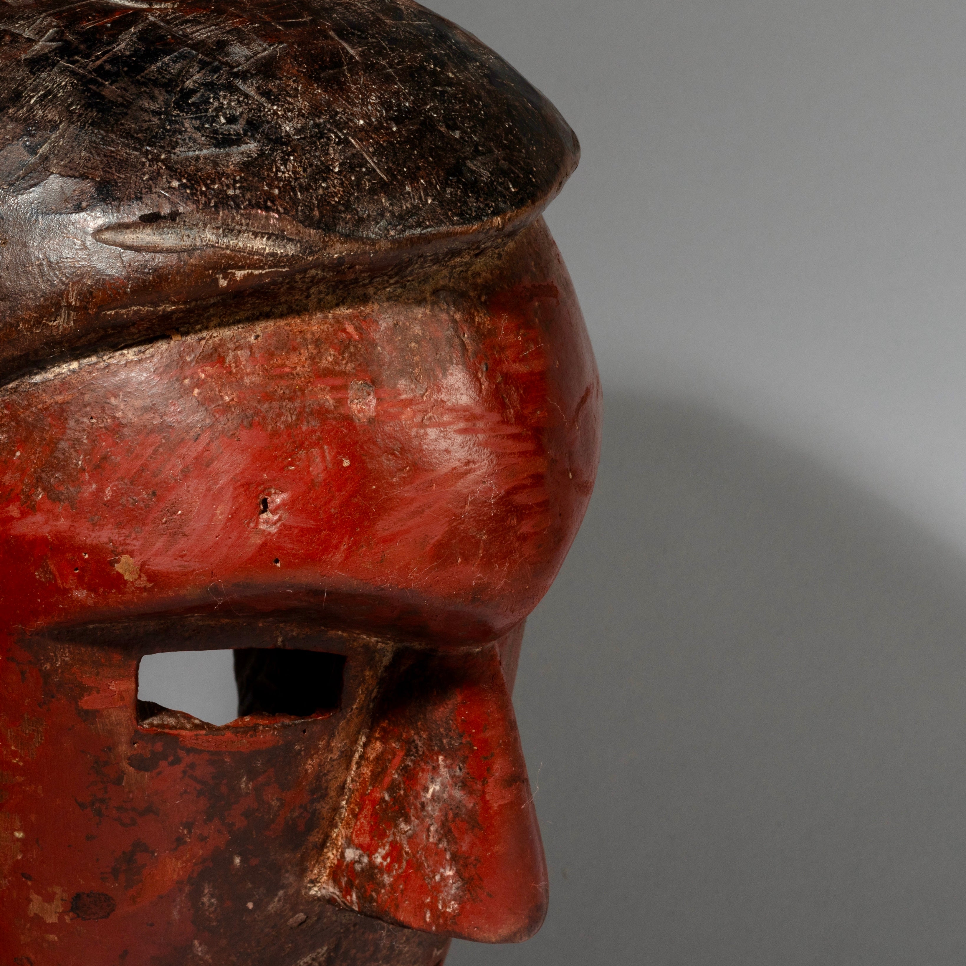 A RED SCULPTURAL + SUBSTANTIAL MASK FROM THE SUKUMA TRIBE, TANZANIA, EAST AFRICA( No 2130 )