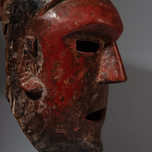 A RED SCULPTURAL + SUBSTANTIAL MASK FROM THE SUKUMA TRIBE, TANZANIA, EAST AFRICA( No 2130 )