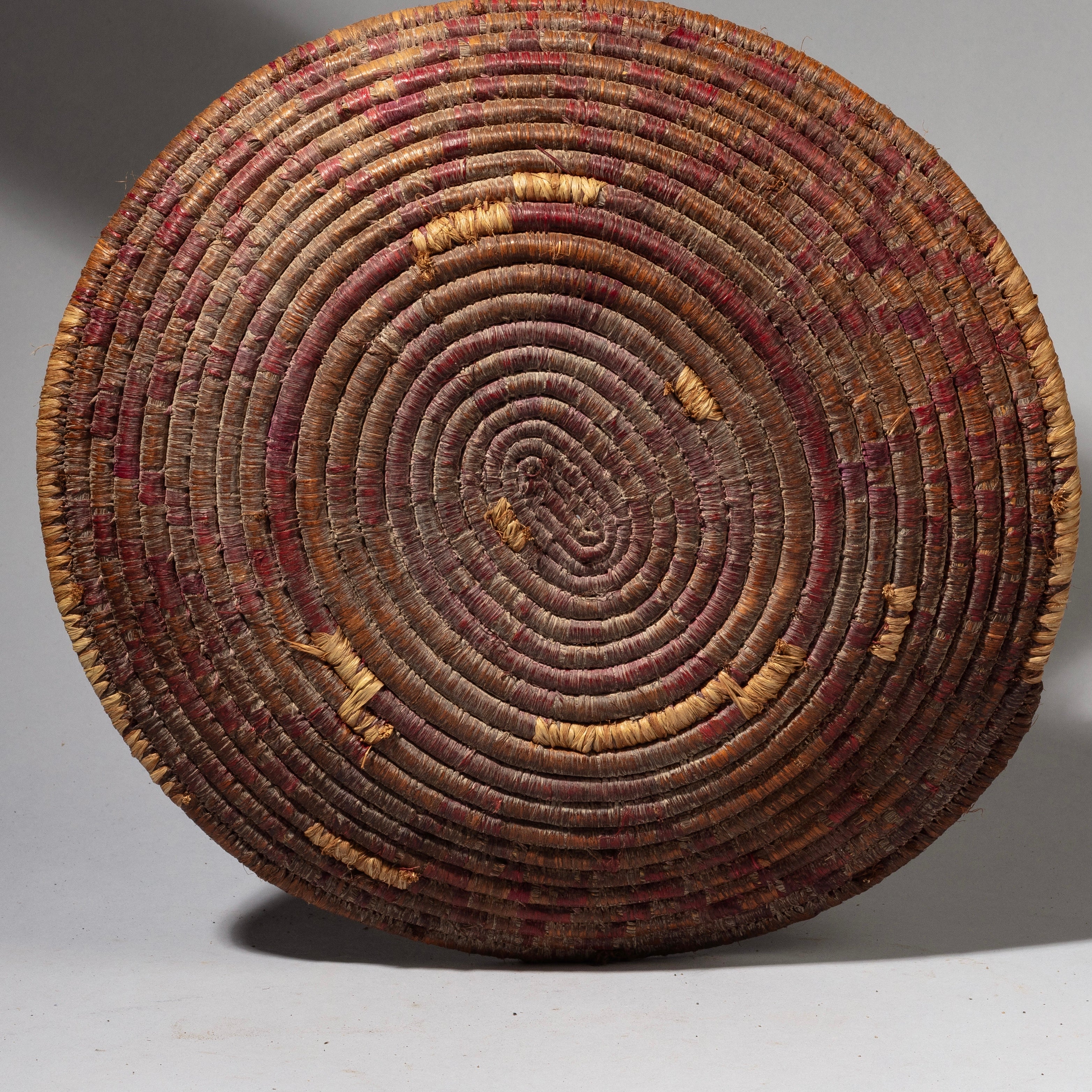 A WOVEN FIBRE BASKET WITH RED DESIGN FROM TUTSI TRIBE RWANDA( No 2177)