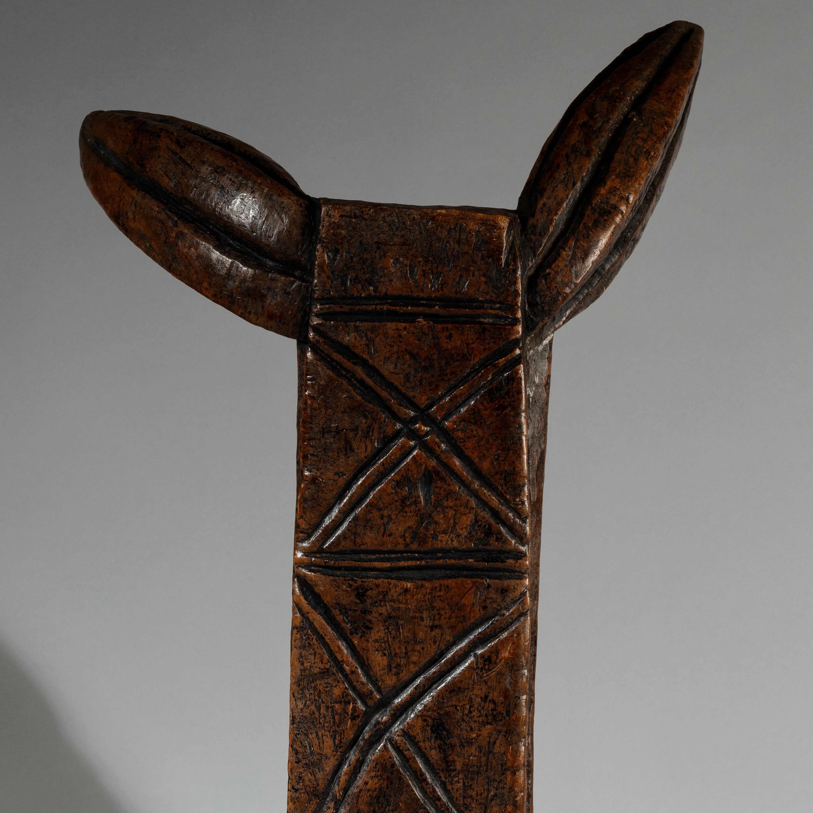 AN ELEGANT LONG LOBI STOOL FROM THE IVORY COAST W.AFRICA  ( No 1365)