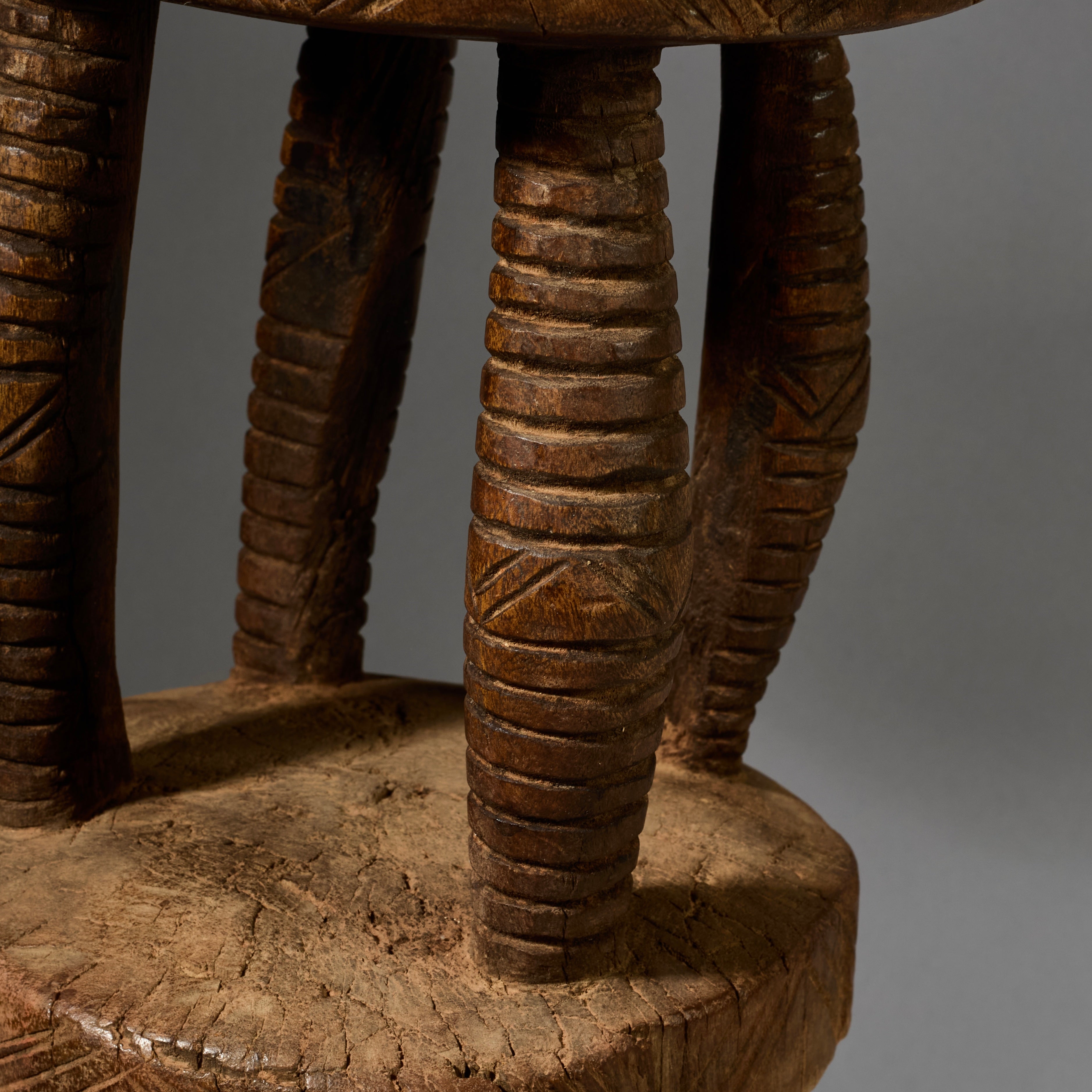 A SOLID  MEDIUM SIZED GEOMETRIC STOOL FROM THE DOGON TRIBE OF MALI WEST AFRICA( No 6257)