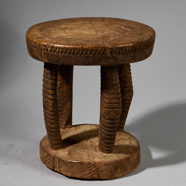 A SOLID  MEDIUM SIZED GEOMETRIC STOOL FROM THE DOGON TRIBE OF MALI WEST AFRICA( No 6257)