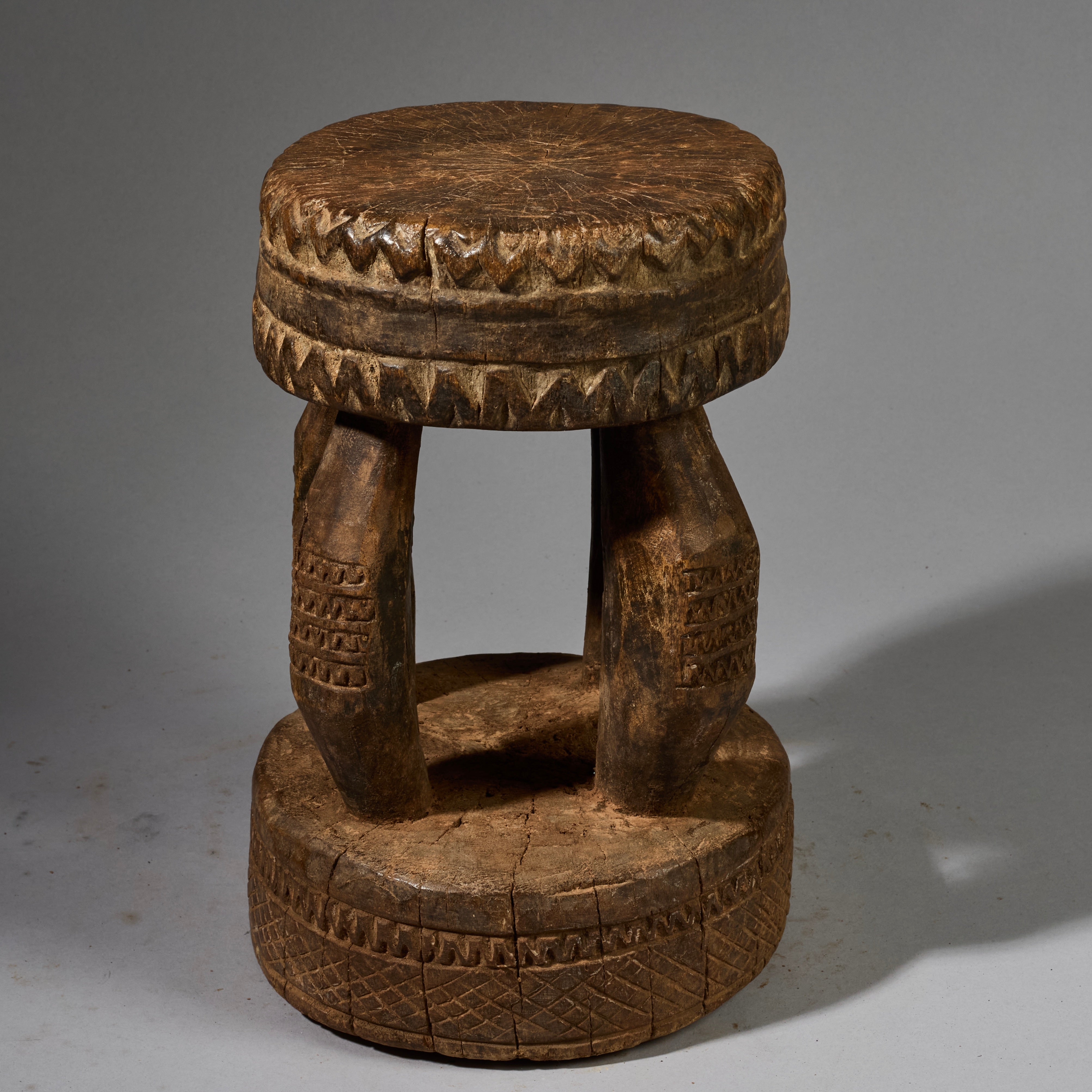 A SOLID GEOMETRIC  MEDIUM STOOL FROM THE DOGON TRIBE OF MALI WEST AFRICA( No 6258 )