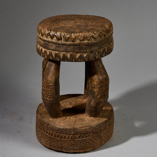 A SOLID GEOMETRIC  MEDIUM STOOL FROM THE DOGON TRIBE OF MALI WEST AFRICA( No 6258 )