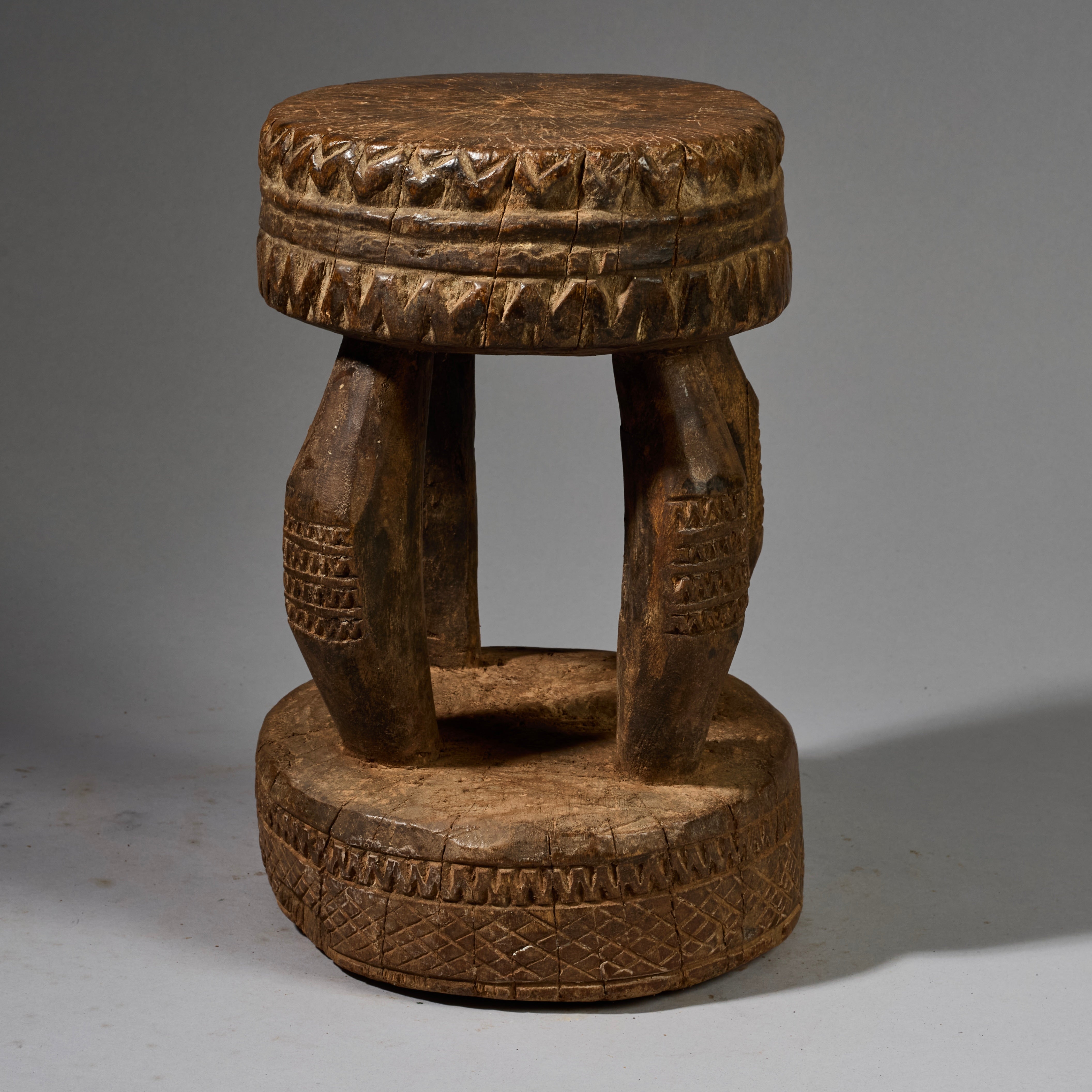 A SOLID GEOMETRIC  MEDIUM STOOL FROM THE DOGON TRIBE OF MALI WEST AFRICA( No 6258 )