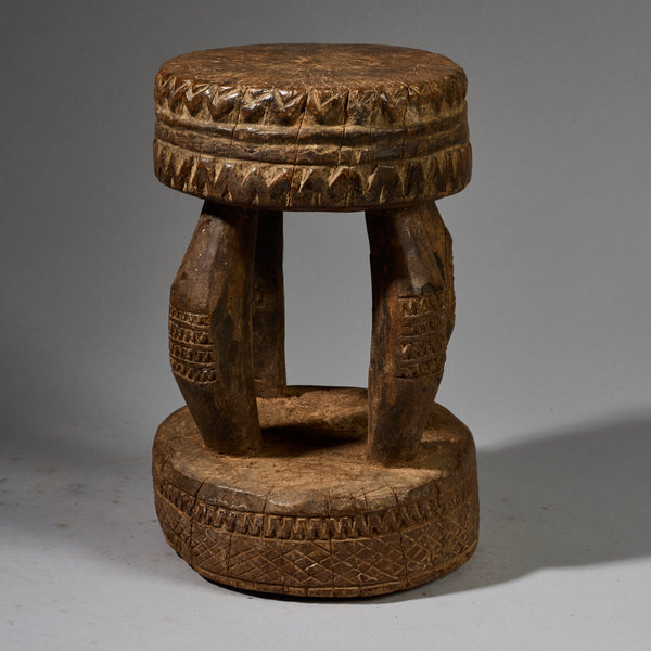 A SOLID GEOMETRIC  MEDIUM STOOL FROM THE DOGON TRIBE OF MALI WEST AFRICA( No 6258 )