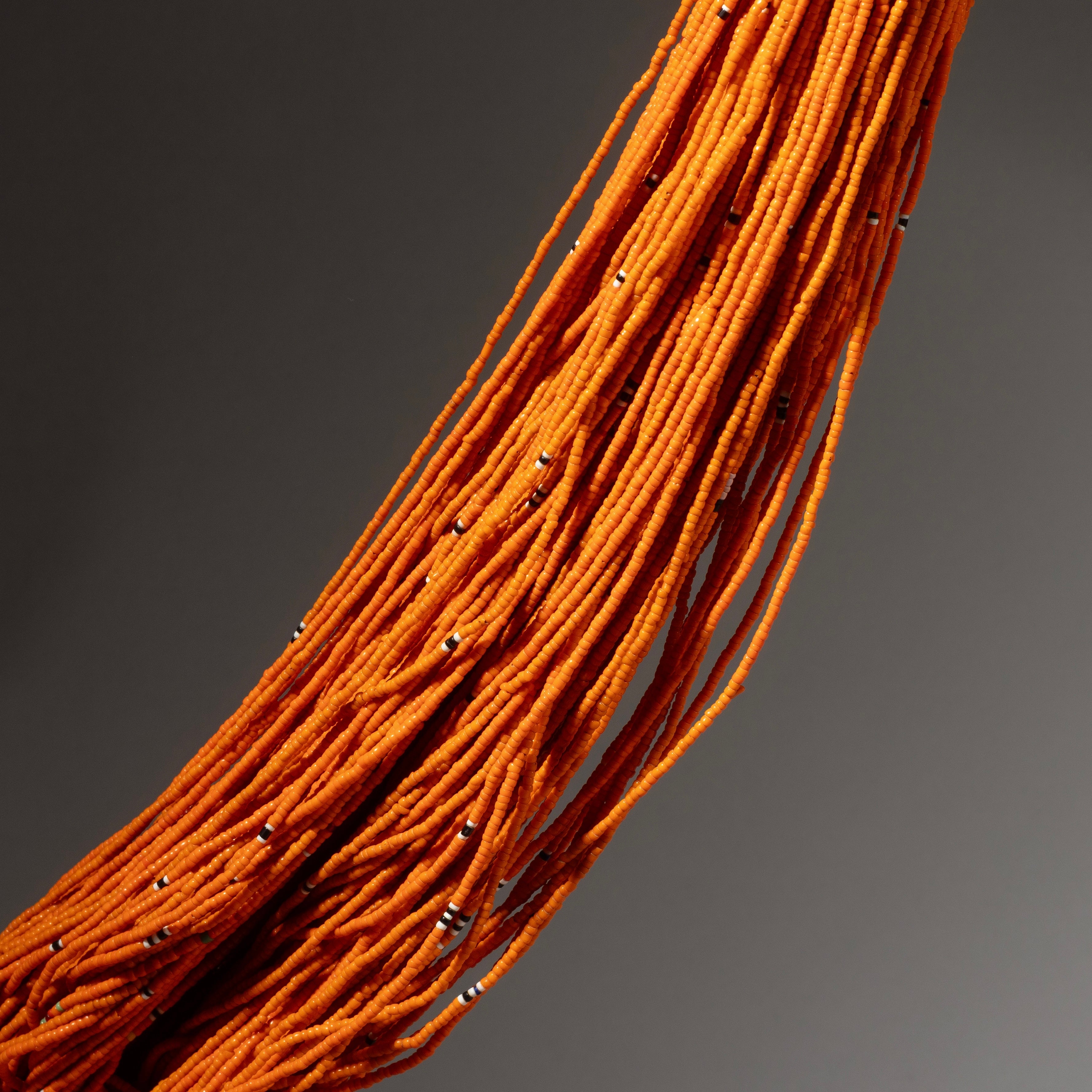 AN ORANGE  MULTISTRAND GLASS NECKLACE, BAULE TRIBE IVORY COAST ( No 2910 )