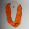 AN ORANGE  MULTISTRAND GLASS NECKLACE, BAULE TRIBE IVORY COAST ( No 2910 )