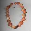 AN ORANGE  PECTEN SHELL NECKLACE,  BAULE TRIBE IVORY COAST ( No 2911 )