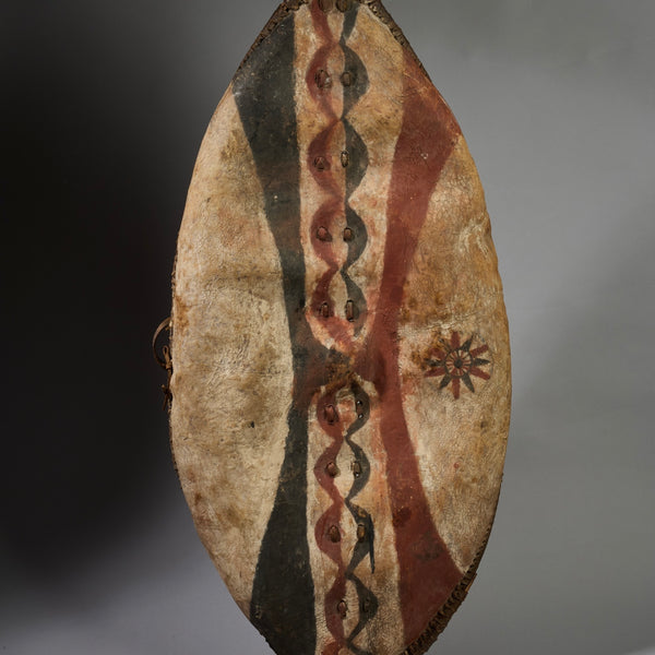 A LARGE GRAPHIC PIGMENT HIDE SHIELD, MAASAI TRIBE  E.AFRICA..EX UK COLLECTION   ( No 6293 )