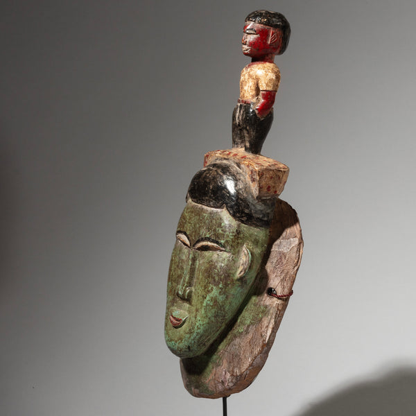 A PRETTY PAINTED MASK WITH FIGURE ON TOP, BAULE TRIBE IVORY COAST, (No 2947 )