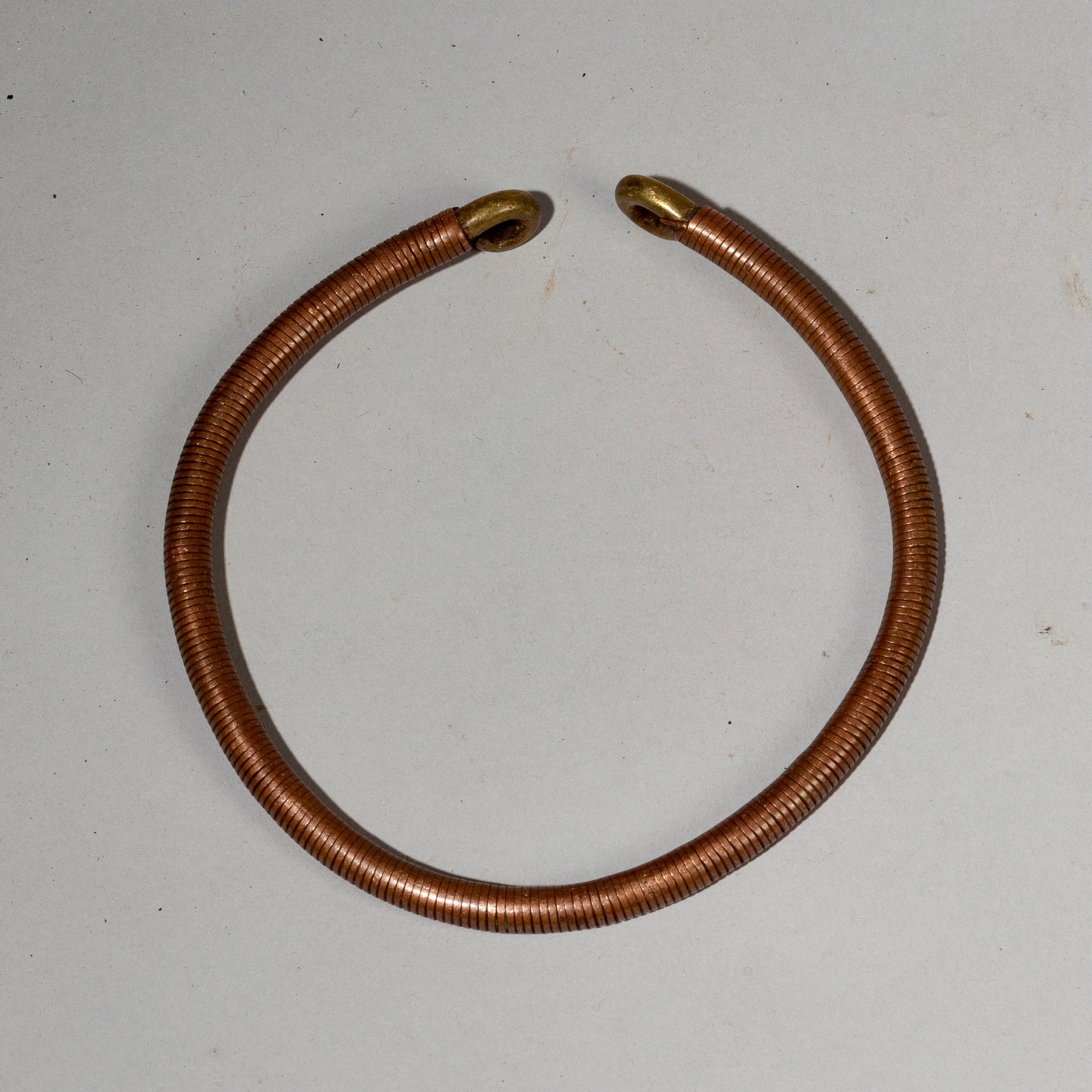 AN ANTIQUE COPPER + BRASS TORQUE FROM ETHIOPIA( No 2136)