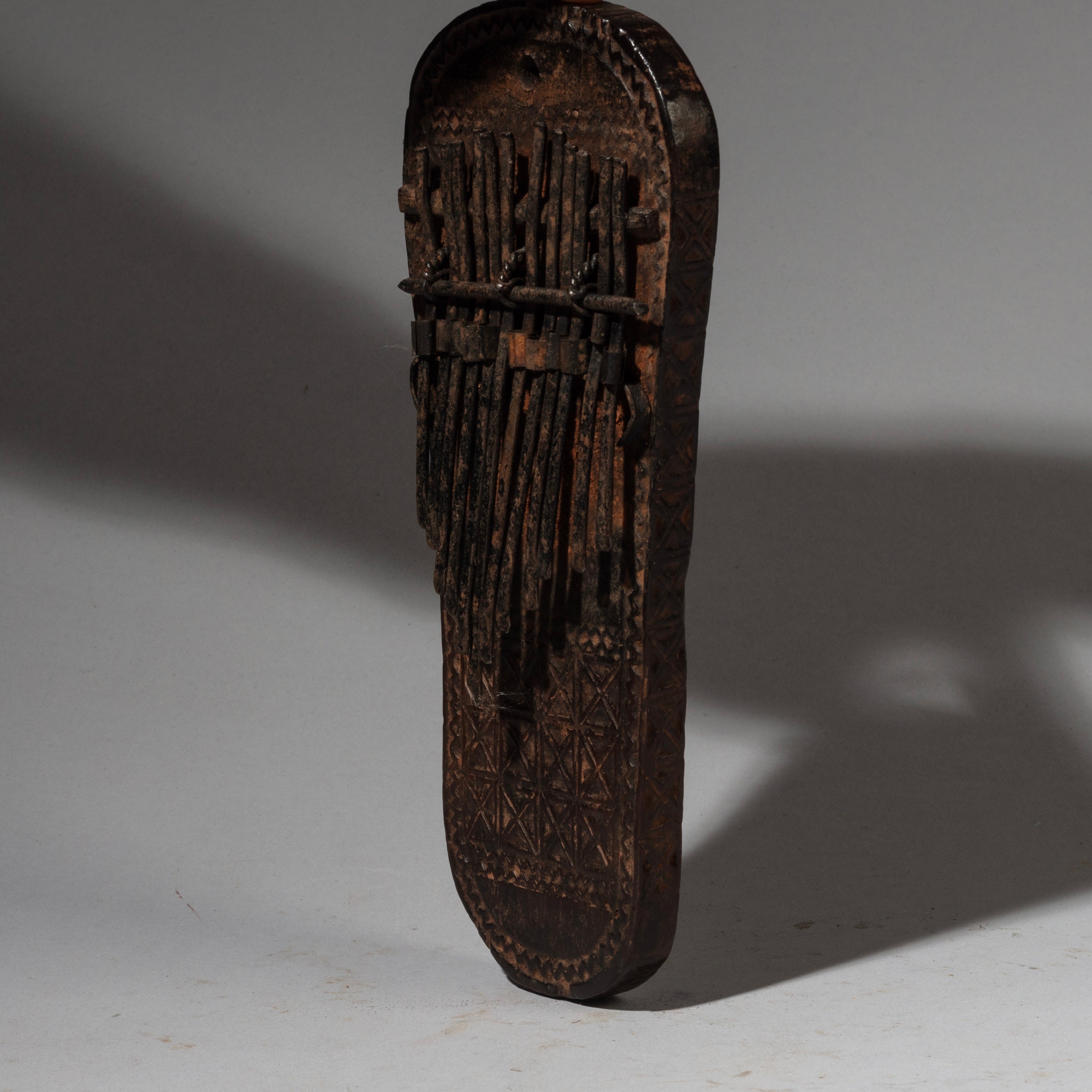 AN INTERESTING THUMB PIANO WITH ENGRAVINGS + DIFFERENT SHAPE, LAGURU TRIBE TANZANIA E.AFRICA ( No 2089)