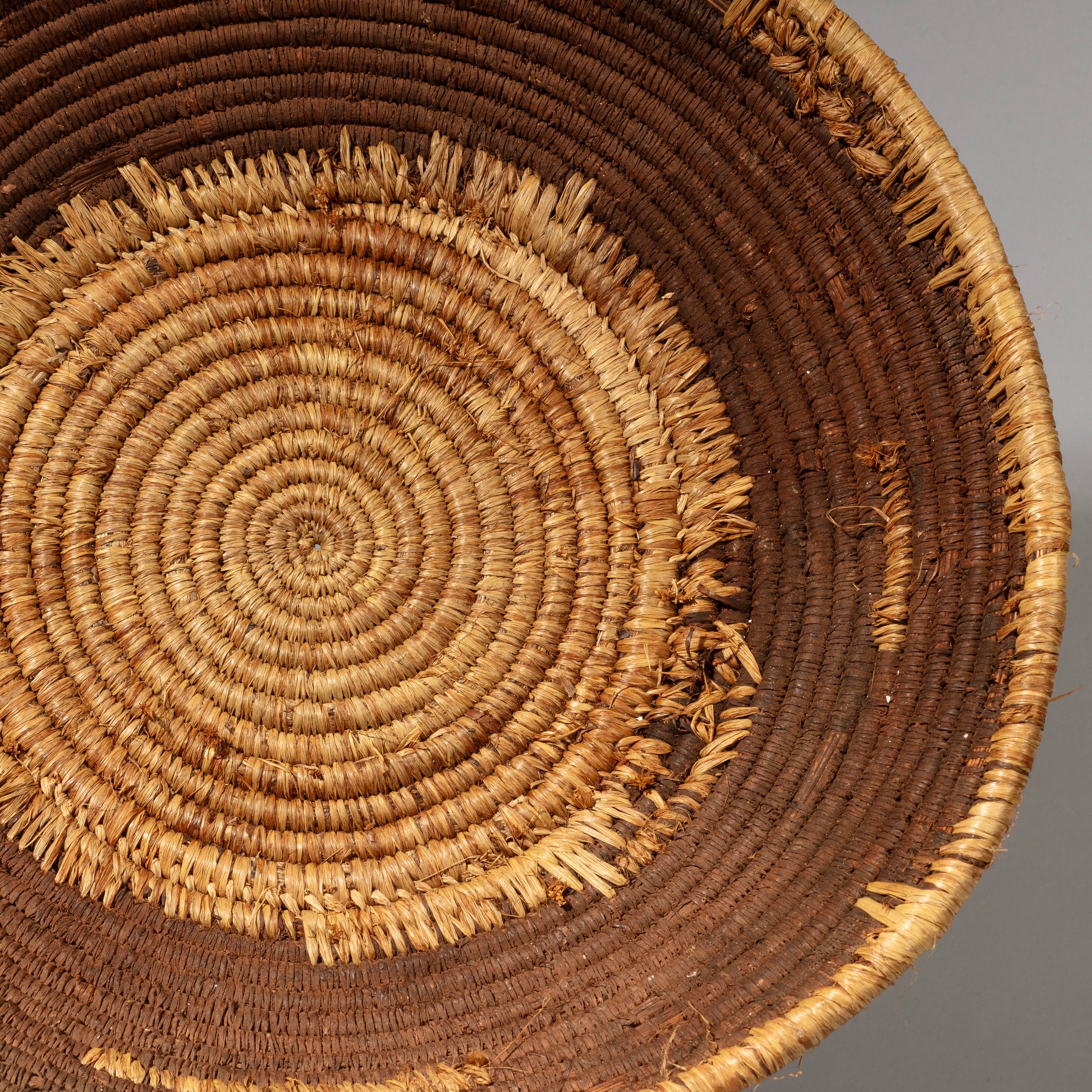 A WOVEN NATURAL FIBRE BASKET FROM TUTSI TRIBE RWANDA( No 2241)