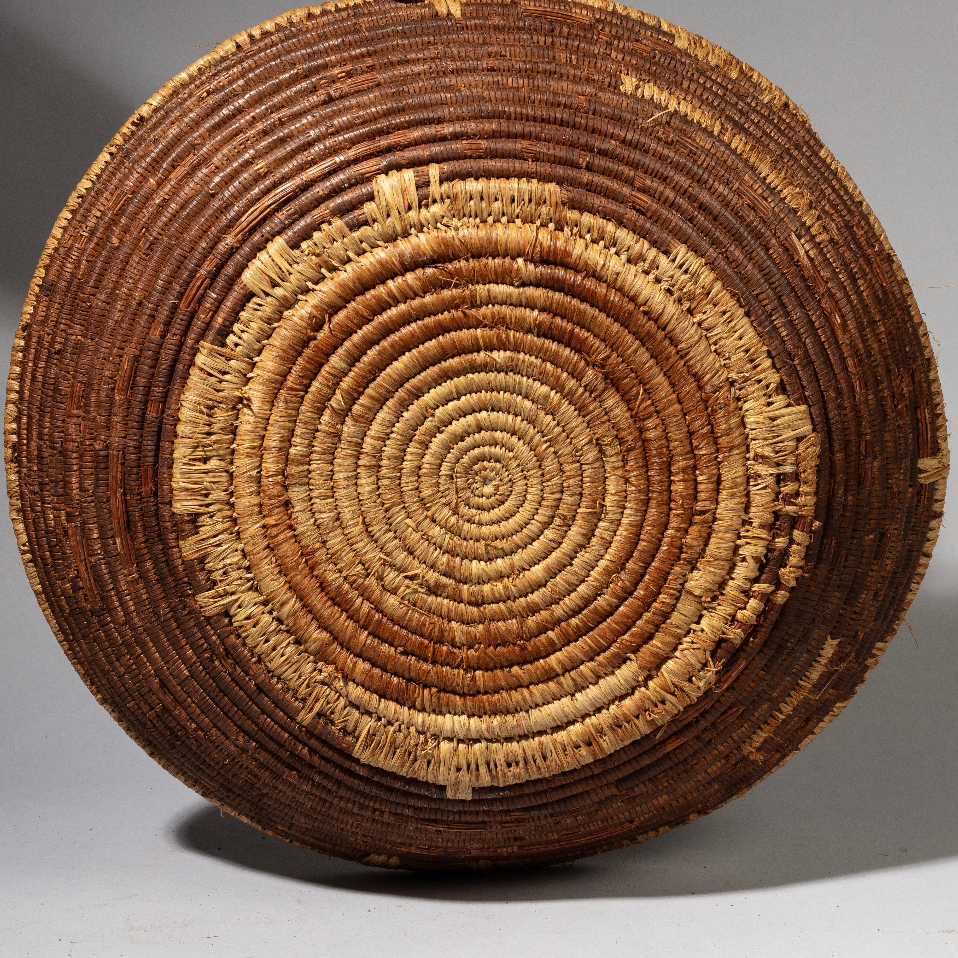 A WOVEN NATURAL FIBRE BASKET FROM TUTSI TRIBE RWANDA( No 2241)