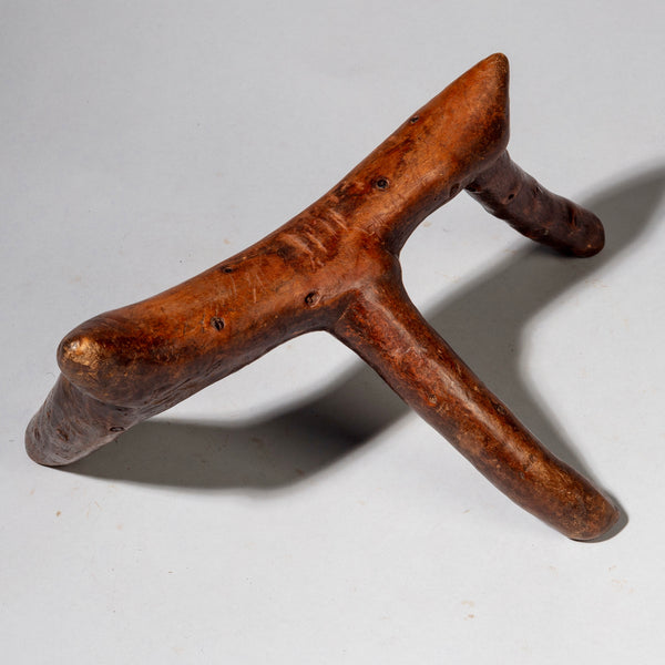 A WARMLY PATINATED 3 LEGGED HEADREST FROM KENYA ( No 2226)