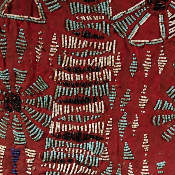 AN ARTISTIC DOUBLE SIDED RED BEADED SHIRT WITH NDOP TRIM, BAMILEKE TRIBE OF CAMEROON ( No 4100 )