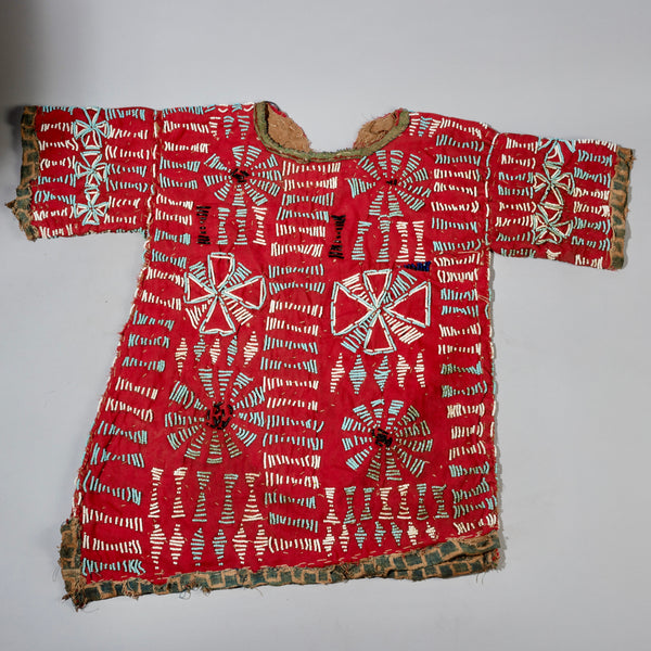 AN ARTISTIC DOUBLE SIDED RED BEADED SHIRT WITH NDOP TRIM, BAMILEKE TRIBE OF CAMEROON ( No 4100 )