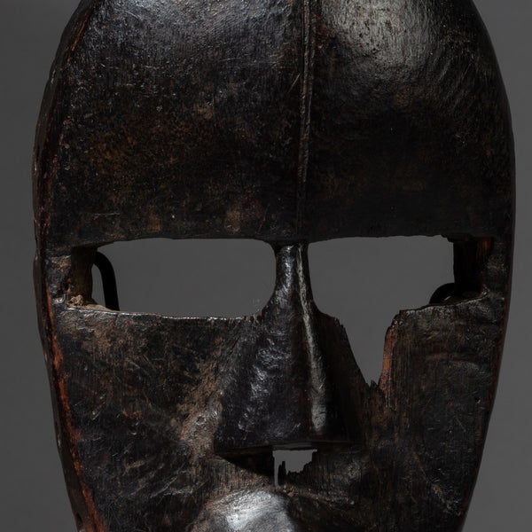 A SMOOTHLY PATINATED DAN MASK FROM THE IVORY COAST ( No 4126 )