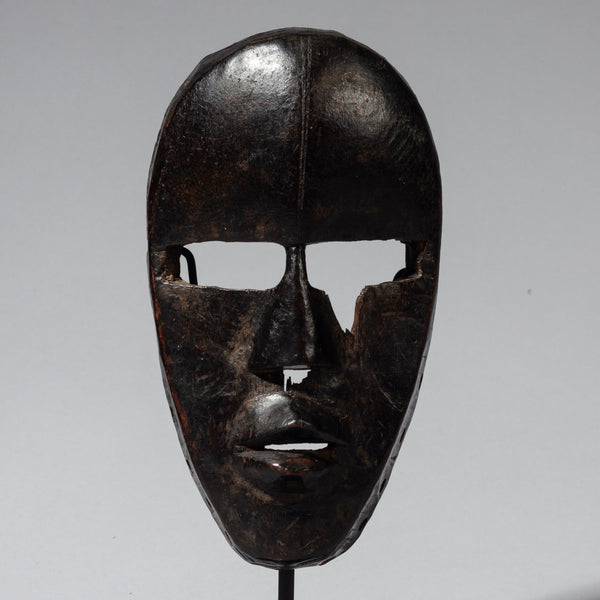 A SMOOTHLY PATINATED DAN MASK FROM THE IVORY COAST ( No 4126 )