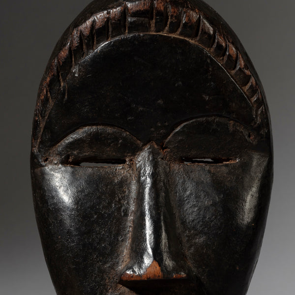 A SERENE DAN MASK FROM THE IVORY COAST ( No 4128 )