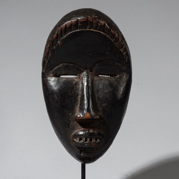 A SERENE DAN MASK FROM THE IVORY COAST ( No 4128 )