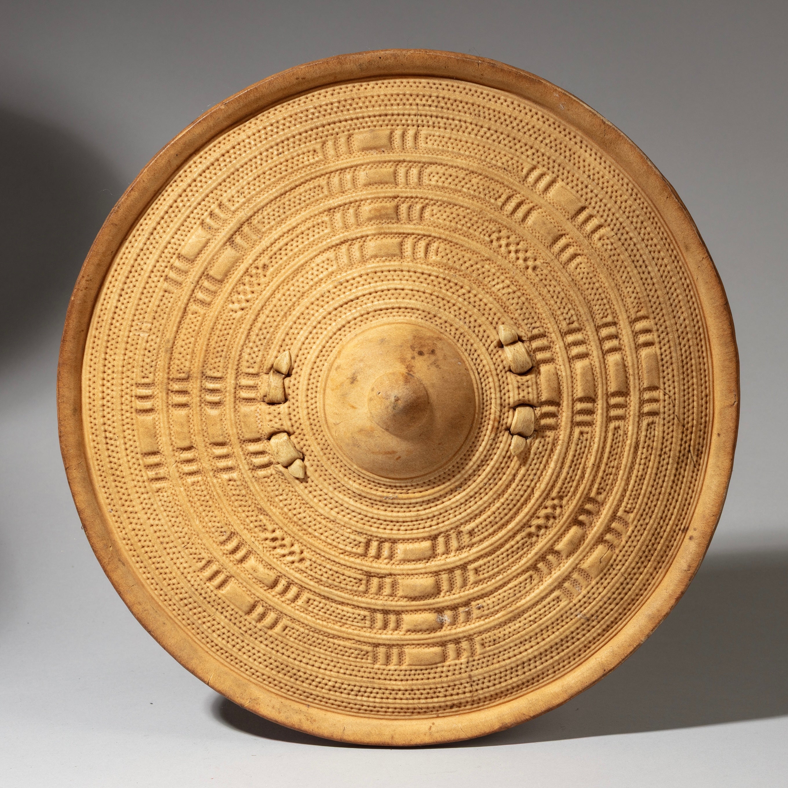 A NEATLY EMBOSSED +PAINTED LEATHER SHIELD, FROM SOMALIA, EAST AFRICA( No 4131 )