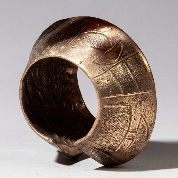 AN ENGRAVED CURRENCY BRONZE BANGLE, NUPE TRIBE NIGERIA( No 2372)
