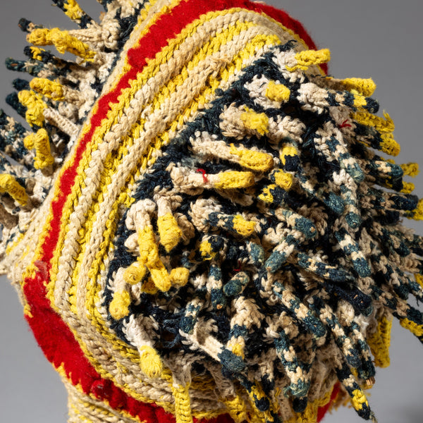 A RED BLUE, YELLOW +WHITE FINGERLING HAT FROM THE BAMILEKE TRIBE OF CAMEROON W.AFRICA( No 2316)