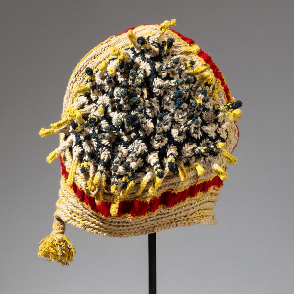 A RED BLUE, YELLOW +WHITE FINGERLING HAT FROM THE BAMILEKE TRIBE OF CAMEROON W.AFRICA( No 2316)