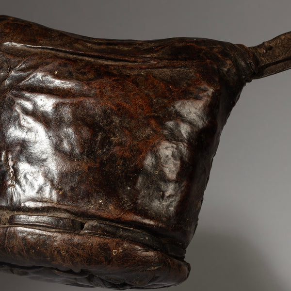A LUSH  PATINATED ETHIOPIAN LEATHER HEADREST, WELL USED, GURAGE TRIBE, E AFRICA EX UK COLLECTION ( No 4150 )