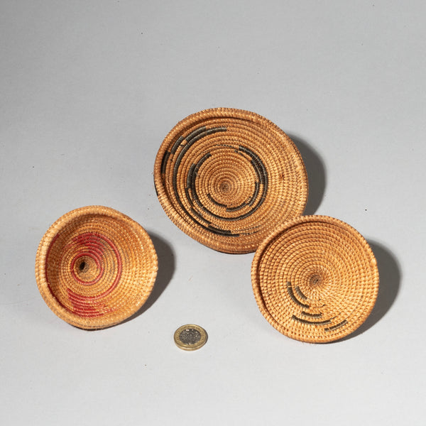 A CLUSTER OF WOVEN LIDS, TUTSI TRIBE RWANDA ( No 2409)