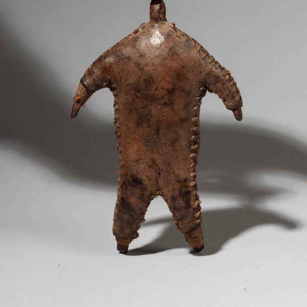 AN OTHERWORLDLY LEATHER BUNDLE DOLL FROM FALI TRIBE OF CAMEROON ( No 2429)