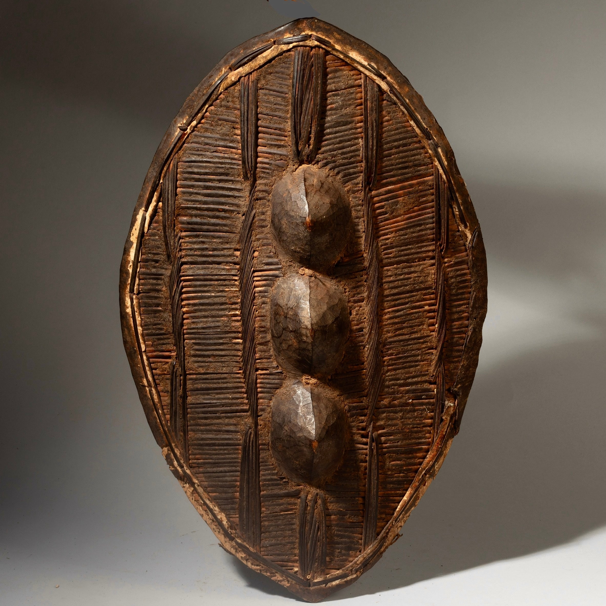 A WOVEN SHIELD WITH 3 NIPPLES, FROM GANDA TRIBE OF NIGERIA, W.AFRICA ( No 4298 )