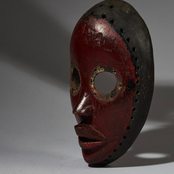 A COLOURFUL MASK FROM THE DAN TRIBE OF THE IVORY COAST ( No 2761 )