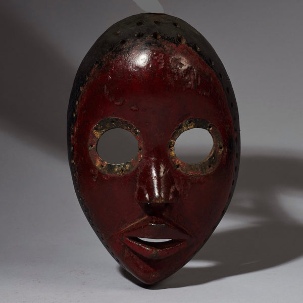 A COLOURFUL MASK FROM THE DAN TRIBE OF THE IVORY COAST ( No 2761 )