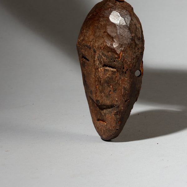 A PRECISE PASSPORT MASK WITH REMNANTS OF PIGMENT , LEGA TRIBE CONGO ( No 4267 )