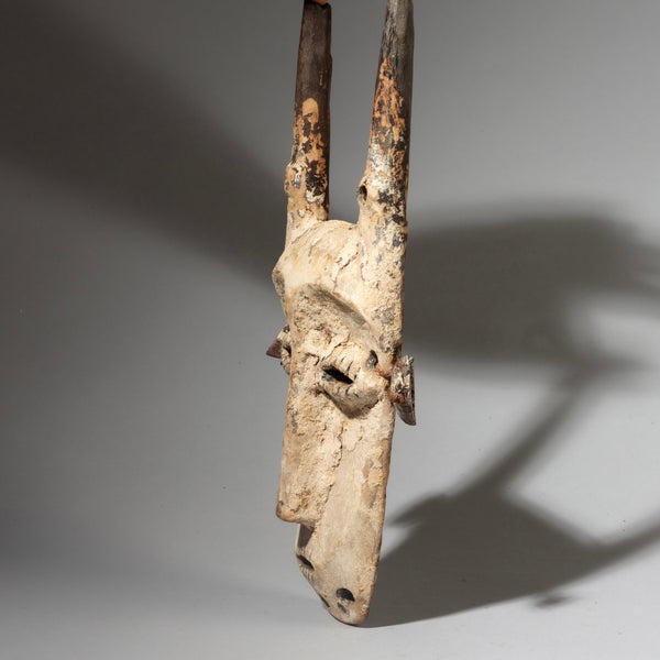 A STRIKING  “IDIMU” KAOLIN ENCRUSTED LEGA TRIBE MASK ( No 4244 )
