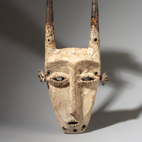 A STRIKING  “IDIMU” KAOLIN ENCRUSTED LEGA TRIBE MASK ( No 4244 )
