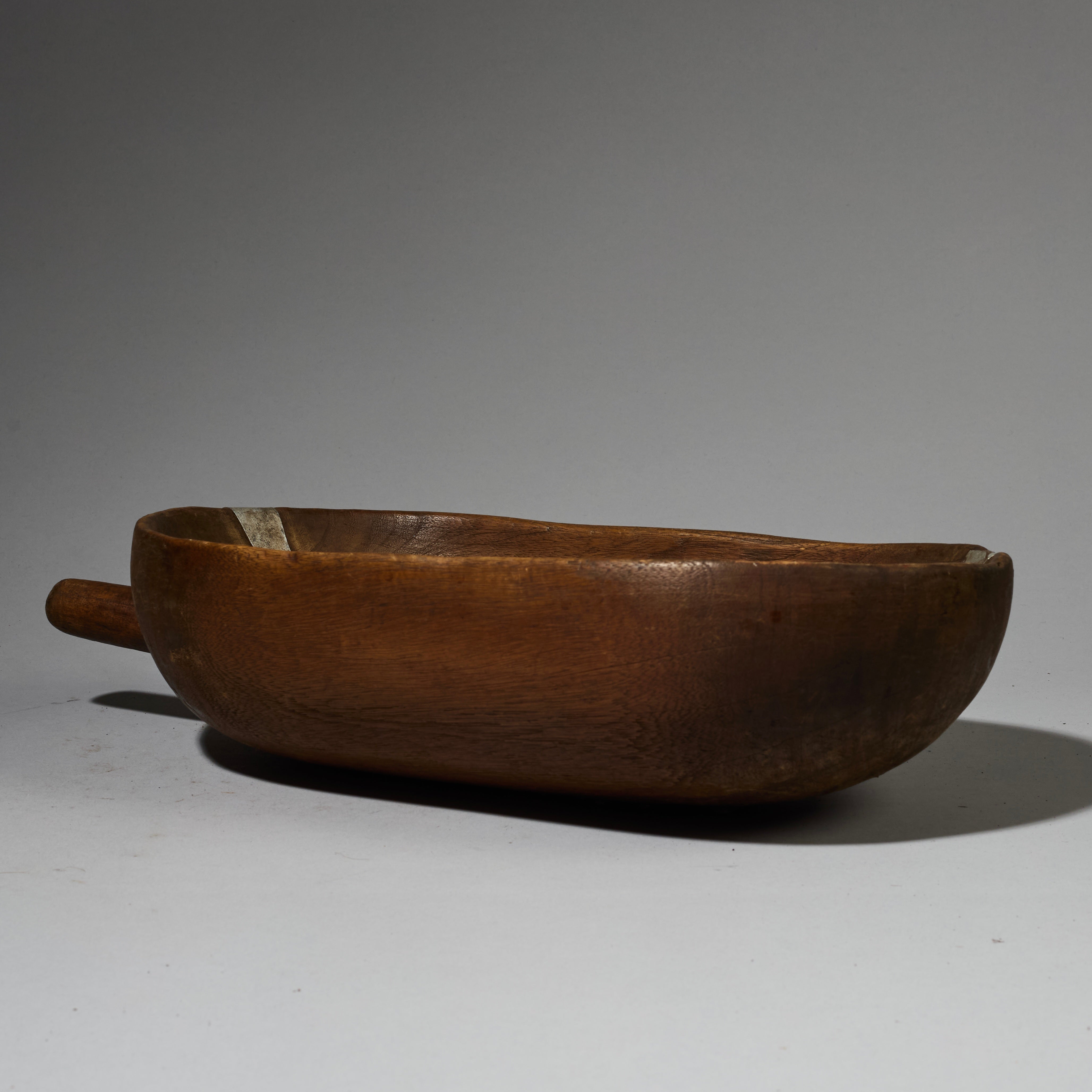 A GENEROUS WOODEN BOWL WITH ARTFUL METAL INDIGENOUS REPAIRS FROM THE TUTSI TRIBE OF RWANDA ( No 2743 )