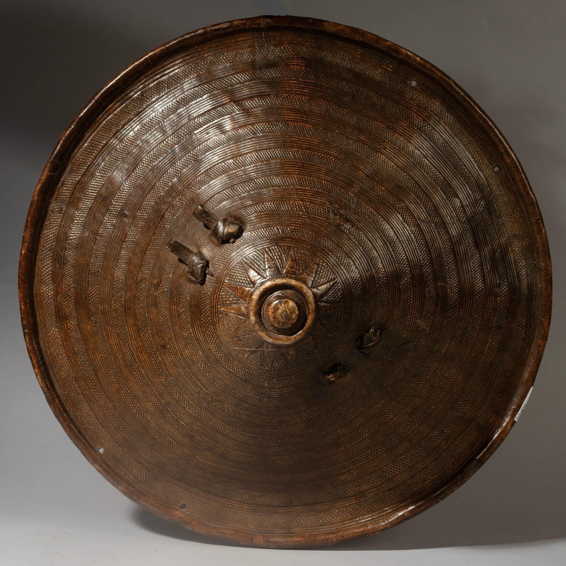 A WONDERFULLY DETAILED, 19THC EMBOSSED LEATHER SHIELD, FROM ETHIOPIA EAST AFRICA EX UK COLL. ( No 4374 )