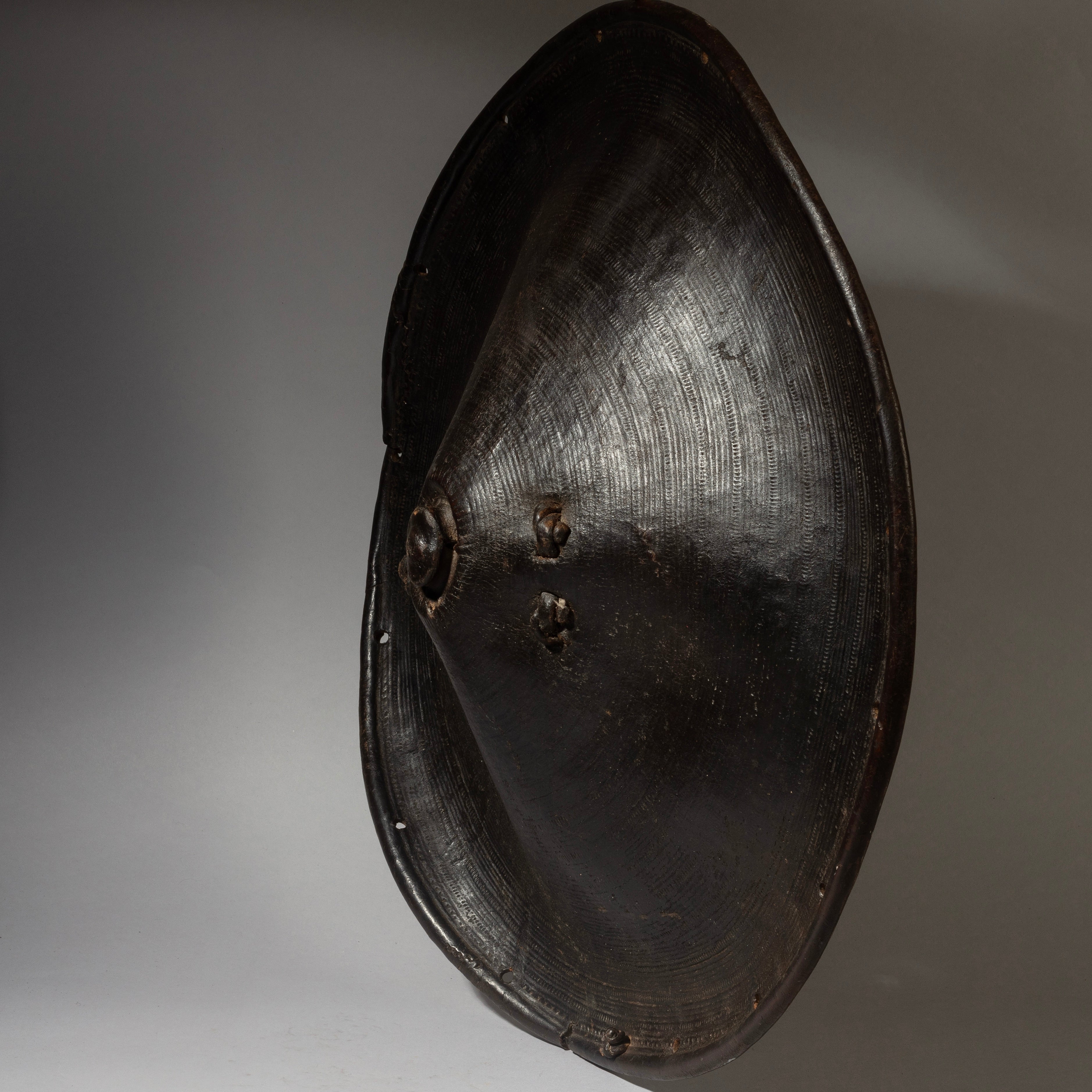 A SCULPTURAL LEATHER SHIELD, FROM ETHIOPIA EAST AFRICA EX UK COLL. ( No 4372 )