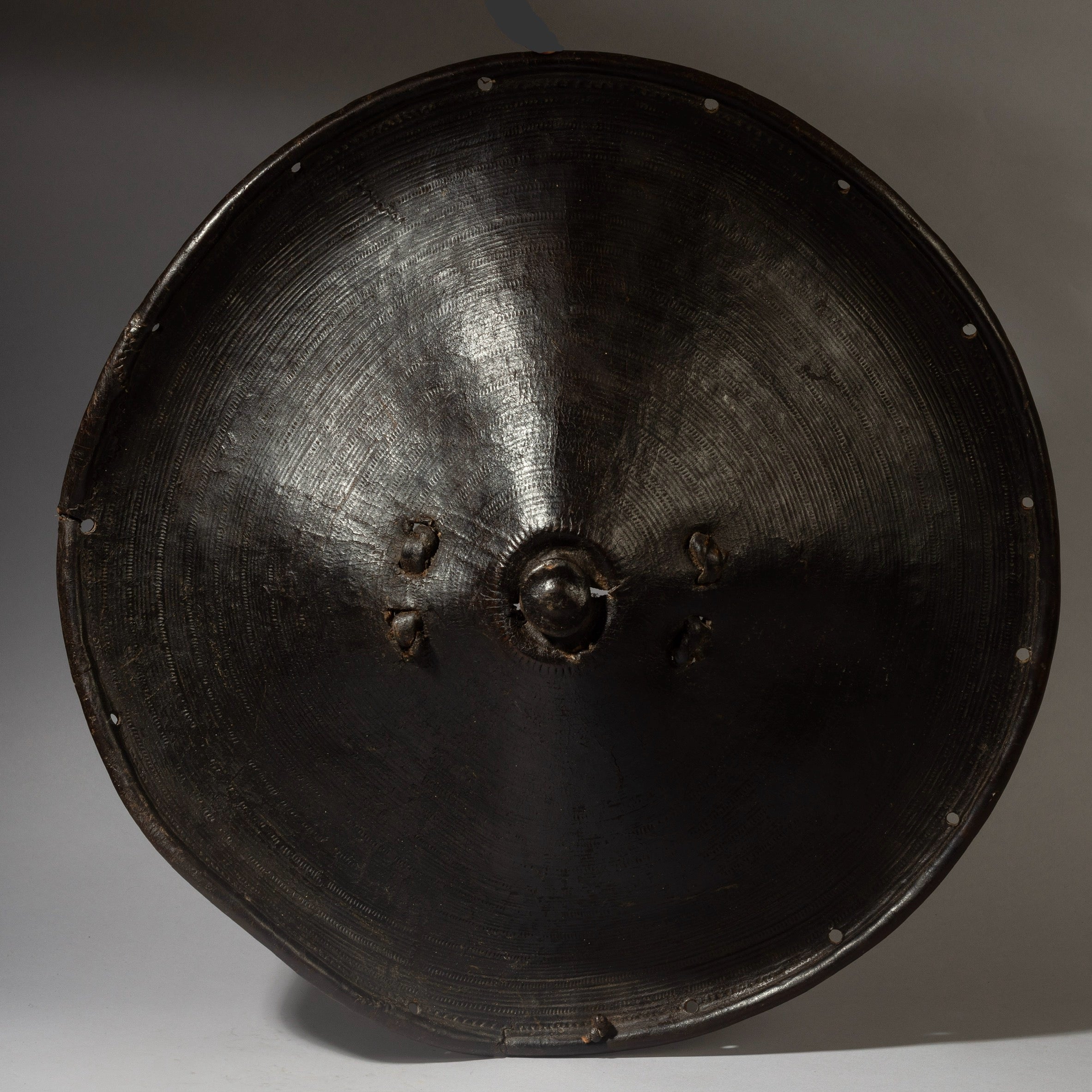 A SCULPTURAL LEATHER SHIELD, FROM ETHIOPIA EAST AFRICA EX UK COLL. ( No 4372 )