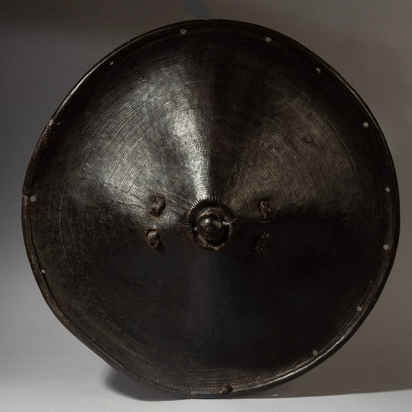 A SCULPTURAL LEATHER SHIELD, FROM ETHIOPIA EAST AFRICA EX UK COLL. ( No 4372 )