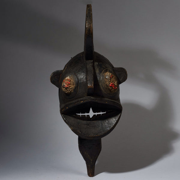 A BLACK BIRD MASK WITH RED SEED EYES  GURUNSI TRIBE BURKINA FASO W.AFRICA ( No 2843  )