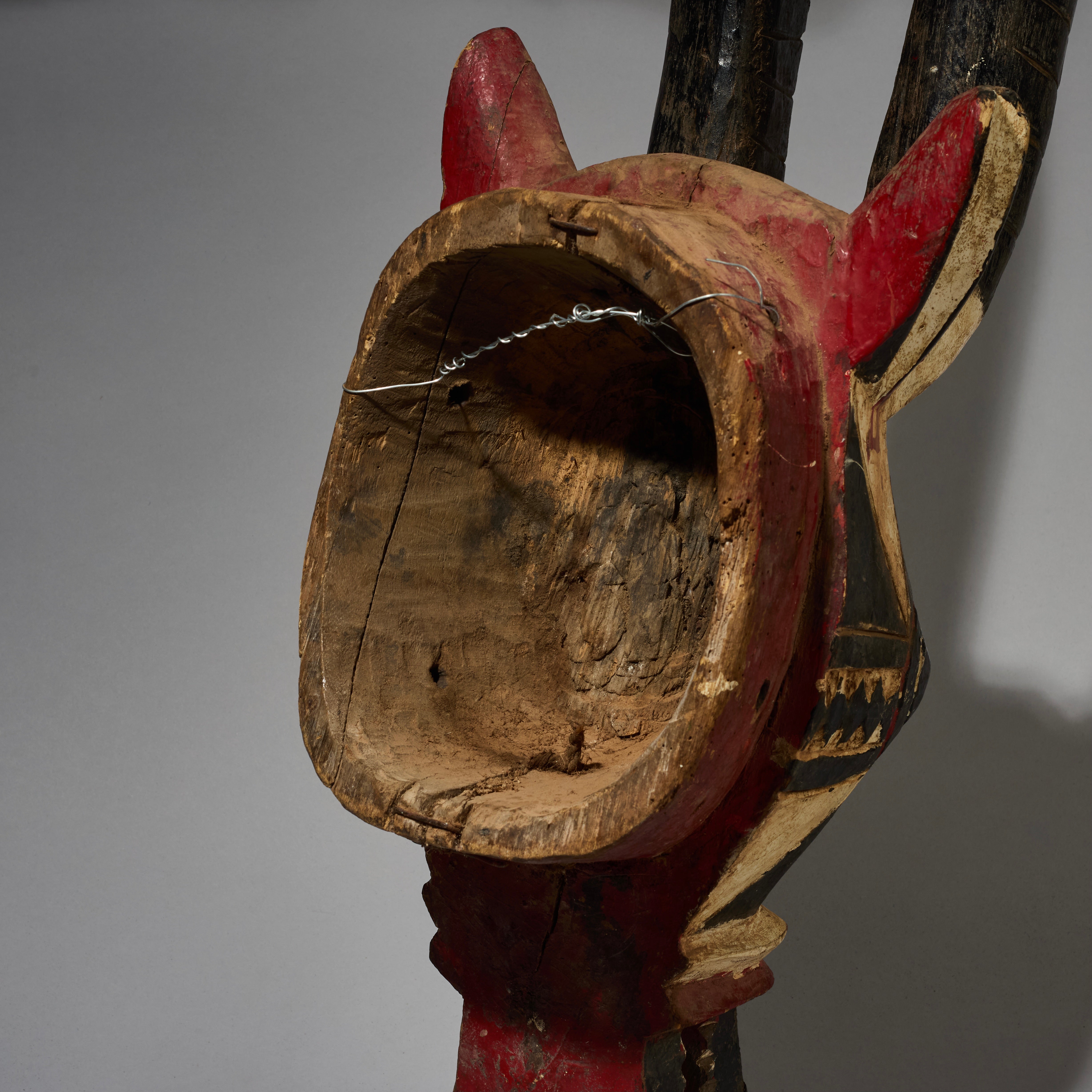 A SHAPELY LARGE BLACK WHITE +RED ANTELOPE MASK FROM THE MOSSI TRIBE OF BURKINA FASO ( No 2820 )