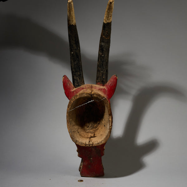 A SHAPELY LARGE BLACK WHITE +RED ANTELOPE MASK FROM THE MOSSI TRIBE OF BURKINA FASO ( No 2820 )