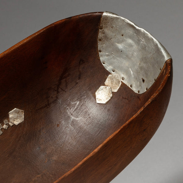 A CURVY  WOODEN MEDIUMBOWL WITH METAL INDIGENOUS REPAIRS FROM THE TUTSI TRIBE OF RWANDA ( No 4320 )
