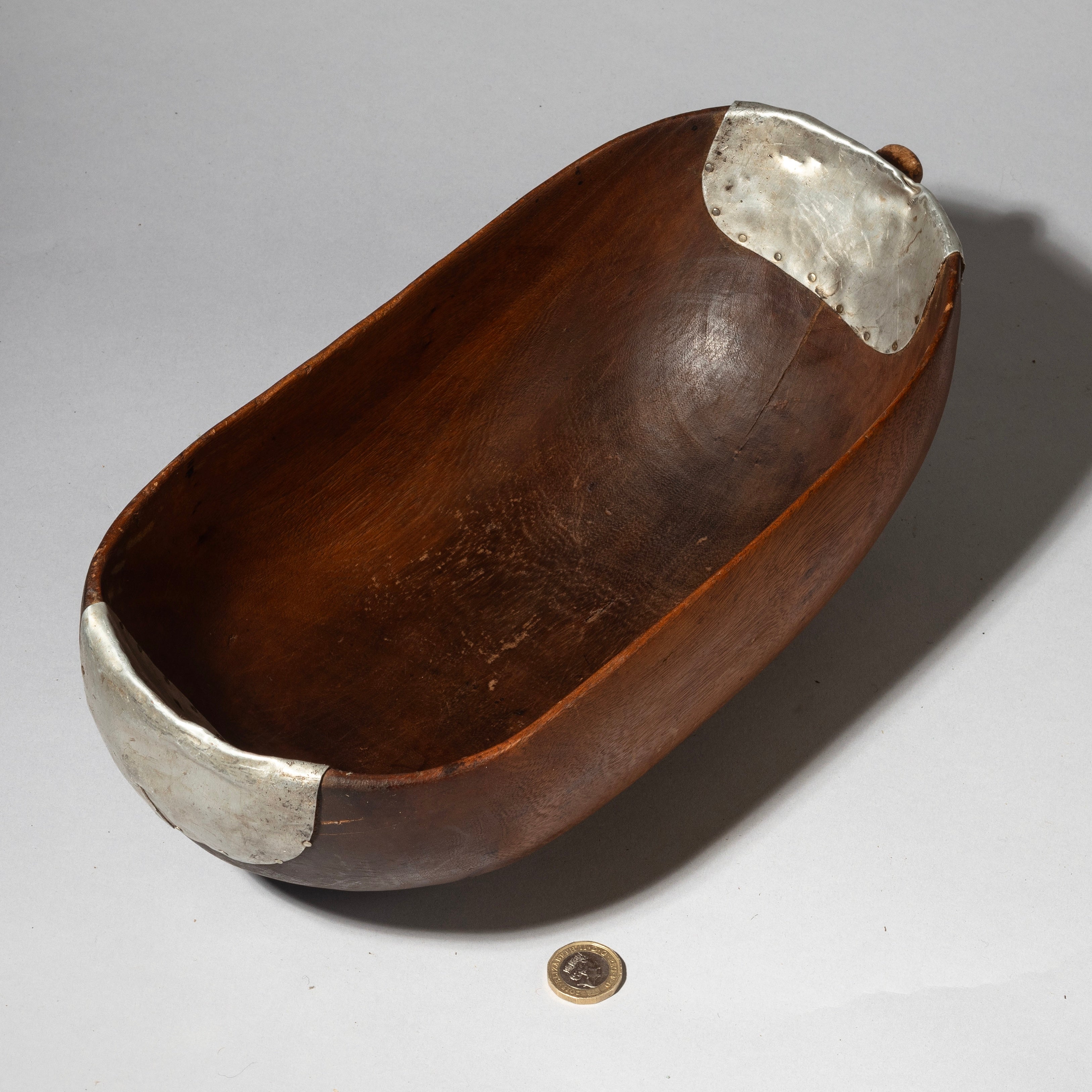 A CURVY  WOODEN MEDIUMBOWL WITH METAL INDIGENOUS REPAIRS FROM THE TUTSI TRIBE OF RWANDA ( No 4320 )