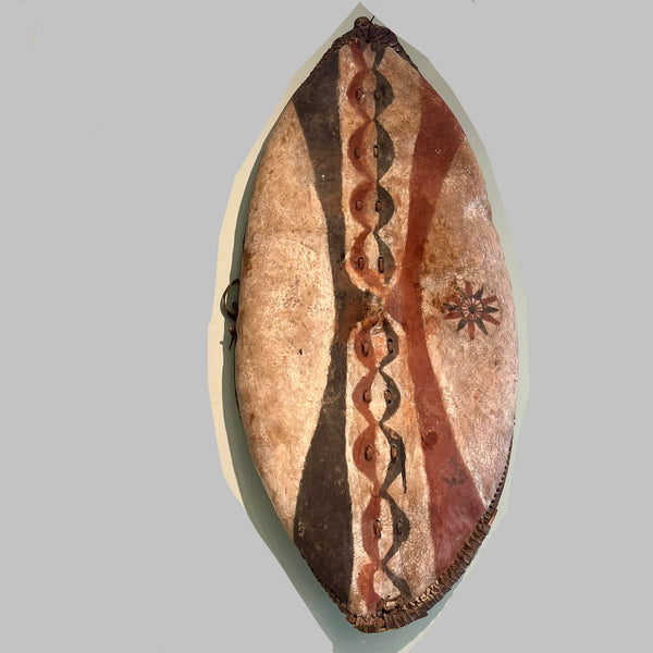 A LARGE GRAPHIC PIGMENT HIDE SHIELD, MAASAI TRIBE  E.AFRICA..EX UK COLLECTION   ( No 6293 )